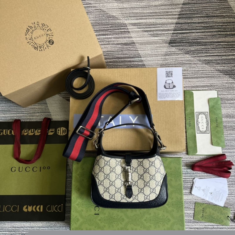 G*u*i top handle bags